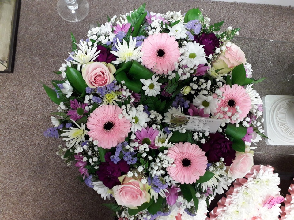 Fantasy Flowers bouquet with range of purple, pink and white flowers.