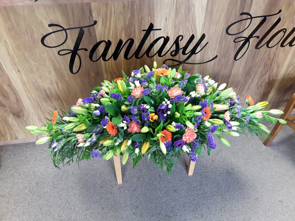 Fantasy Flowers bouquet with a range of purple, white, red and pink flowers