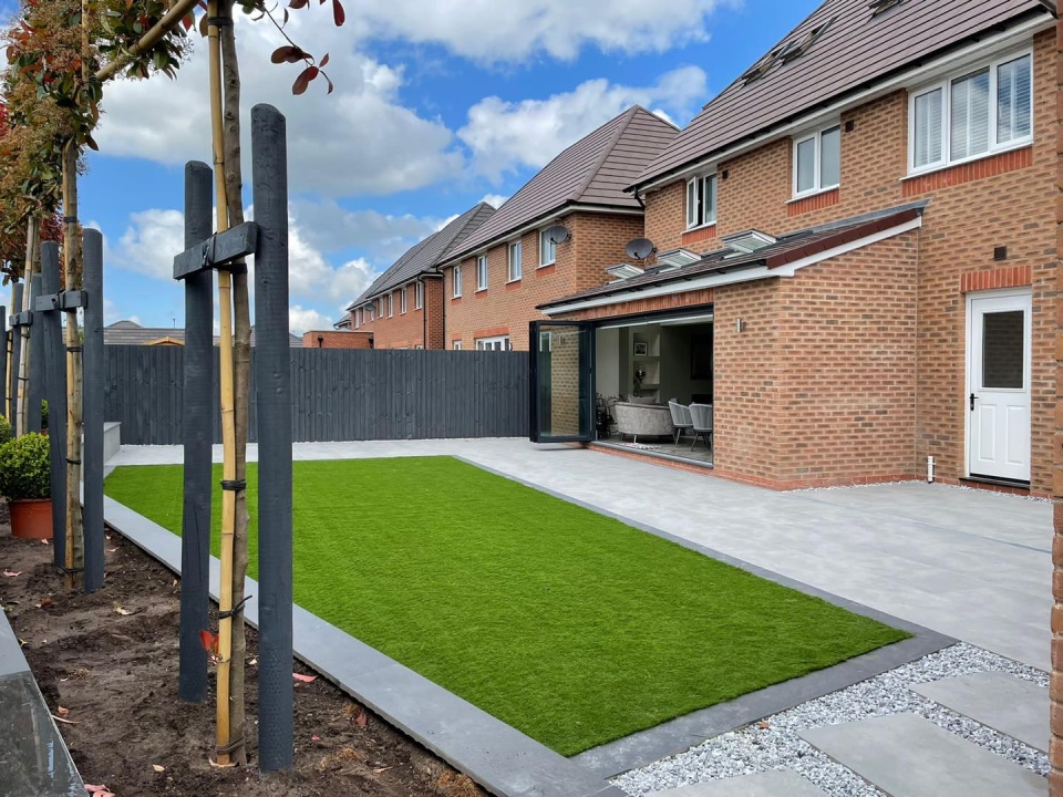 Image of fake grass in a back garden