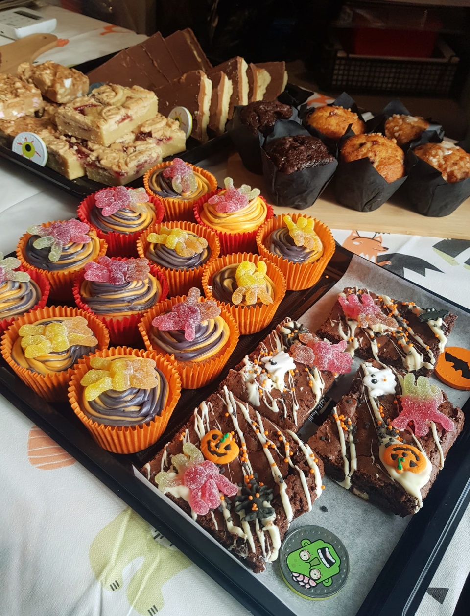 Image of sweet treats (cakes) offered by The Coffee Barn. Includes halloween brownies, cupcakes and muffins,